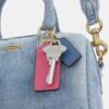 Mini Rowan-crossbodytas in ‘Loved Denim’ met bedels