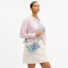 Mini Rowan-crossbodytas in ‘Loved Denim’ met bedels