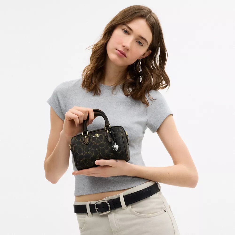 Mini Rowan-crossbodytas van ‘Loved’ Signature Canvas met bedels