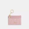 Mini Skinny ID-etui van Loved Denim met doorgestikt patroon en bedels