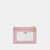 Mini Skinny ID-etui van Loved Denim met doorgestikt patroon en bedels