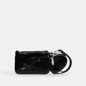 Polsbandtasje en hartvormig etui met bedels