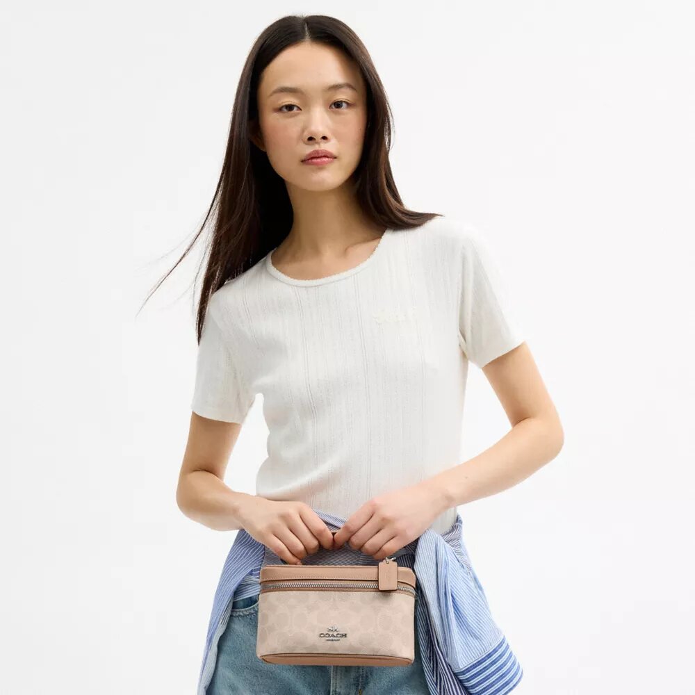 Rainer crossbodytas 18 in Signature Canvas