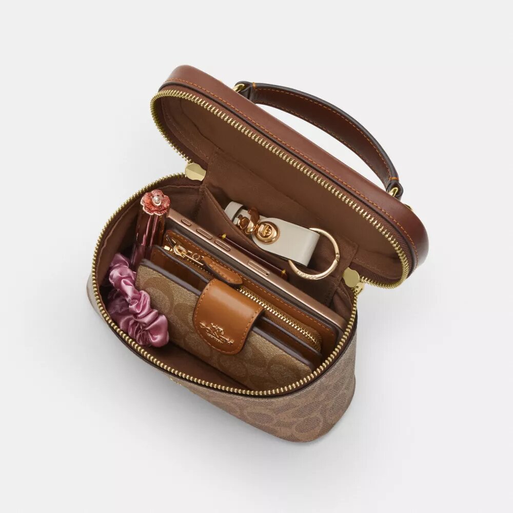 Rainer crossbodytas 18 in Signature Canvas