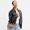 Rainer crossbodytas 18 in Signature Canvas