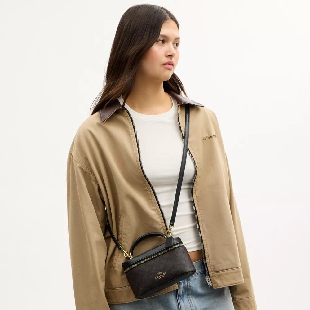 Rainer crossbodytas 18 in Signature Canvas