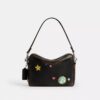 Rexy 10e verjaardag Dakota-crossbodytas van ‘Loved Leather’ met stickerprint