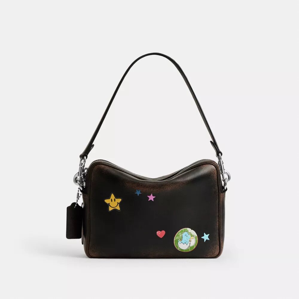 Rexy 10e verjaardag Dakota-crossbodytas van ‘Loved Leather’ met stickerprint