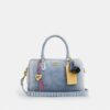 Rowan-satcheltas in 'Loved Denim' met bedels