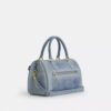Rowan-satcheltas in 'Loved Denim' met bedels