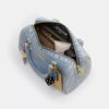 Rowan-satcheltas in 'Loved Denim' met bedels