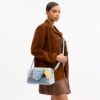 Rowan-satcheltas in 'Loved Denim' met bedels