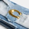 Tabby-schoudertas 26 met patchwork van hergebruikt denim