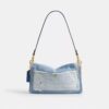 Tabby-schoudertas 26 met patchwork van hergebruikt denim