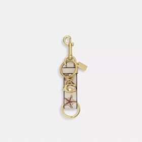 Trigger Snap-tashanger met schelpenprint