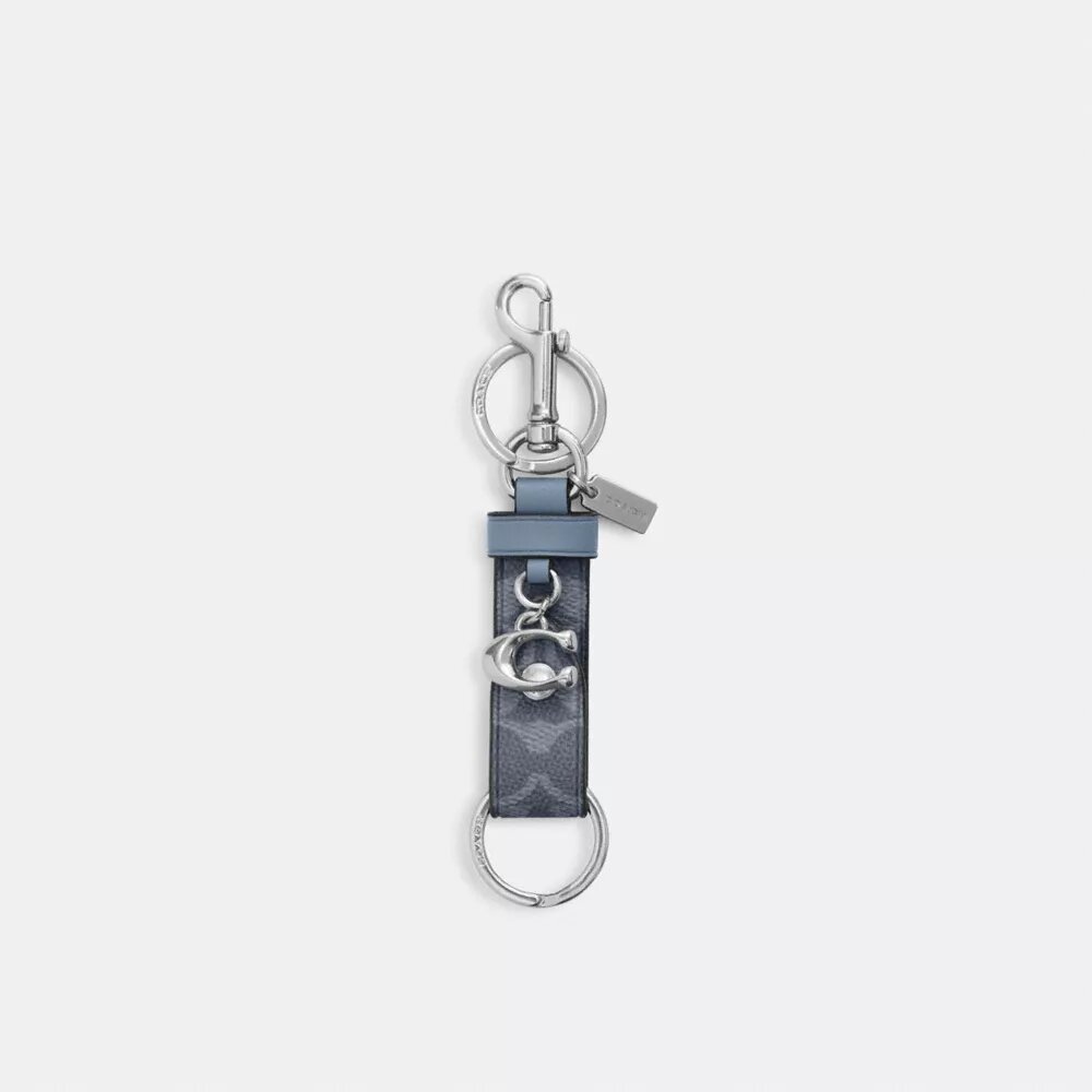 Trigger-tashanger met drukknoop in Signature Canvas met bedel